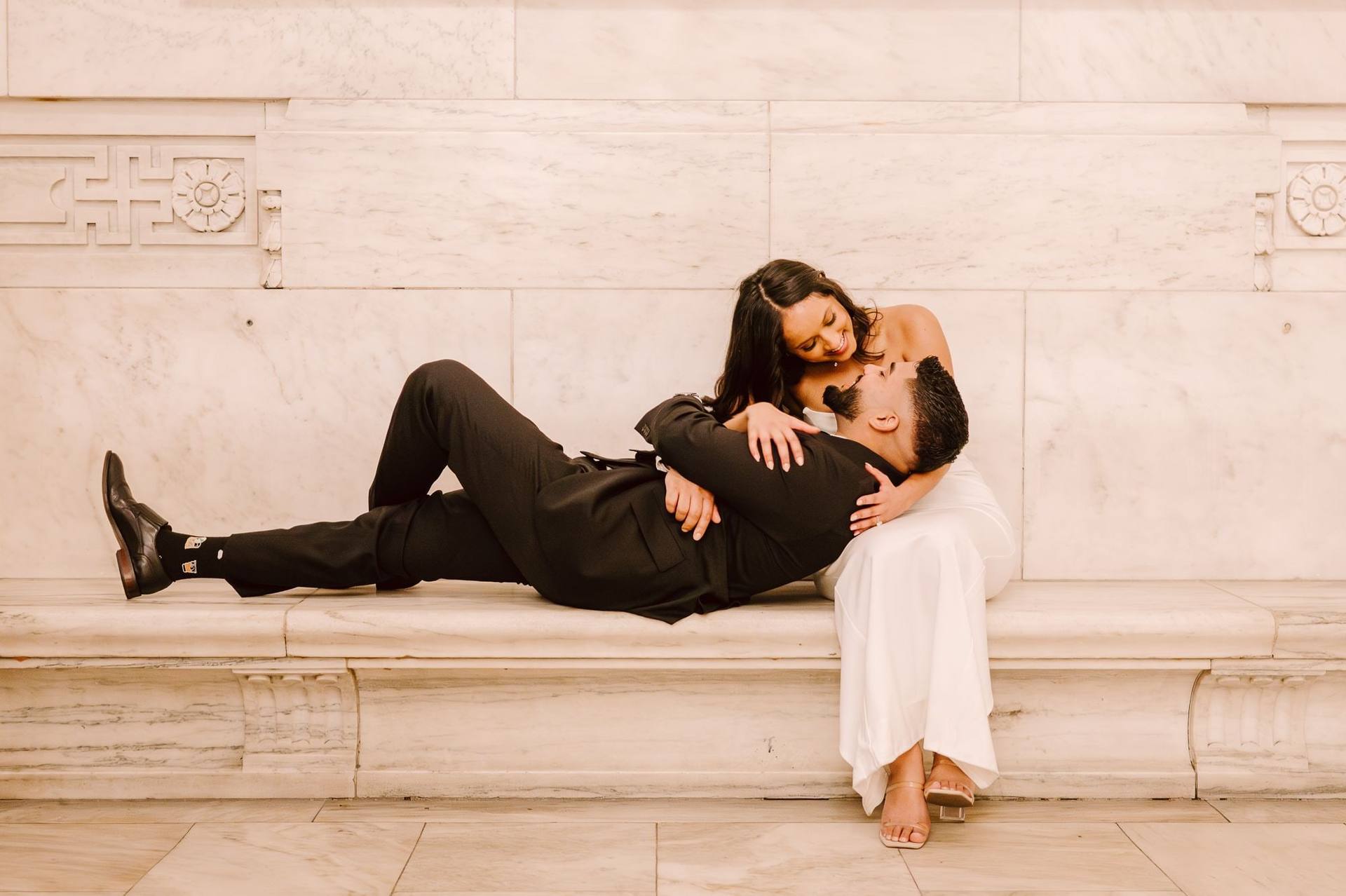 High-fashion recline on a marble ledge