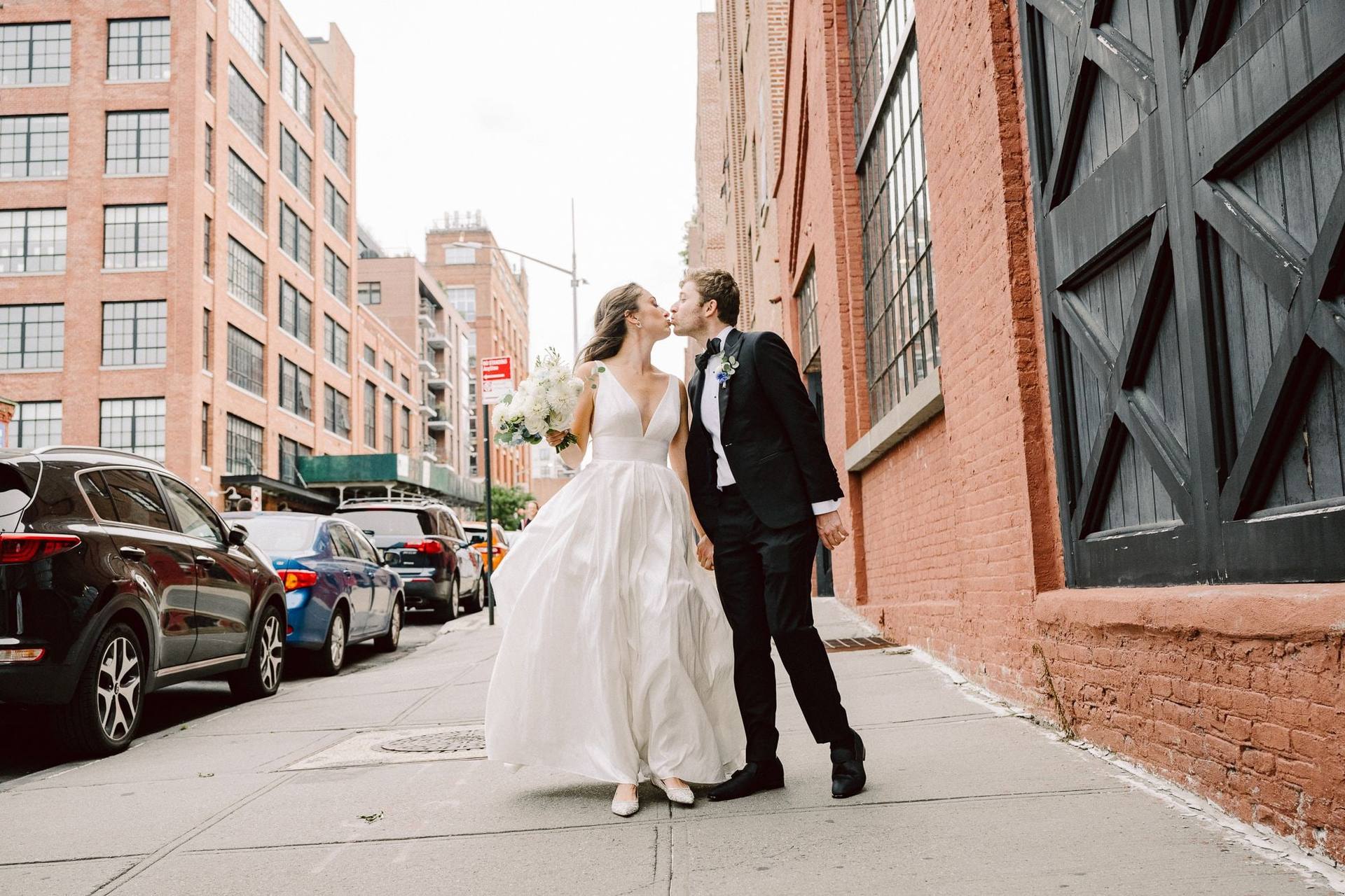 Street kiss with brick warehouses receding