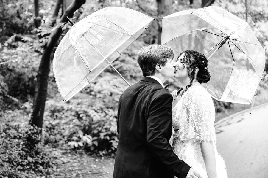 Rain kiss under clear umbrellas in Central Park