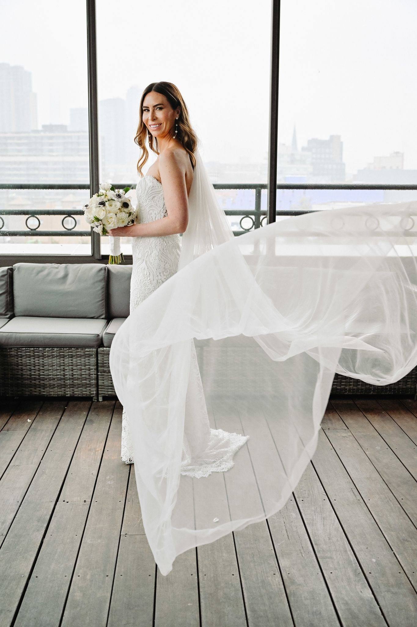Rooftop deck with veil and train swirled at dusk