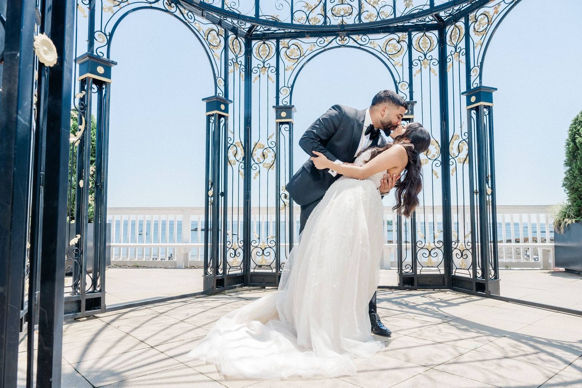 Dip kiss in a waterfront iron gazebo