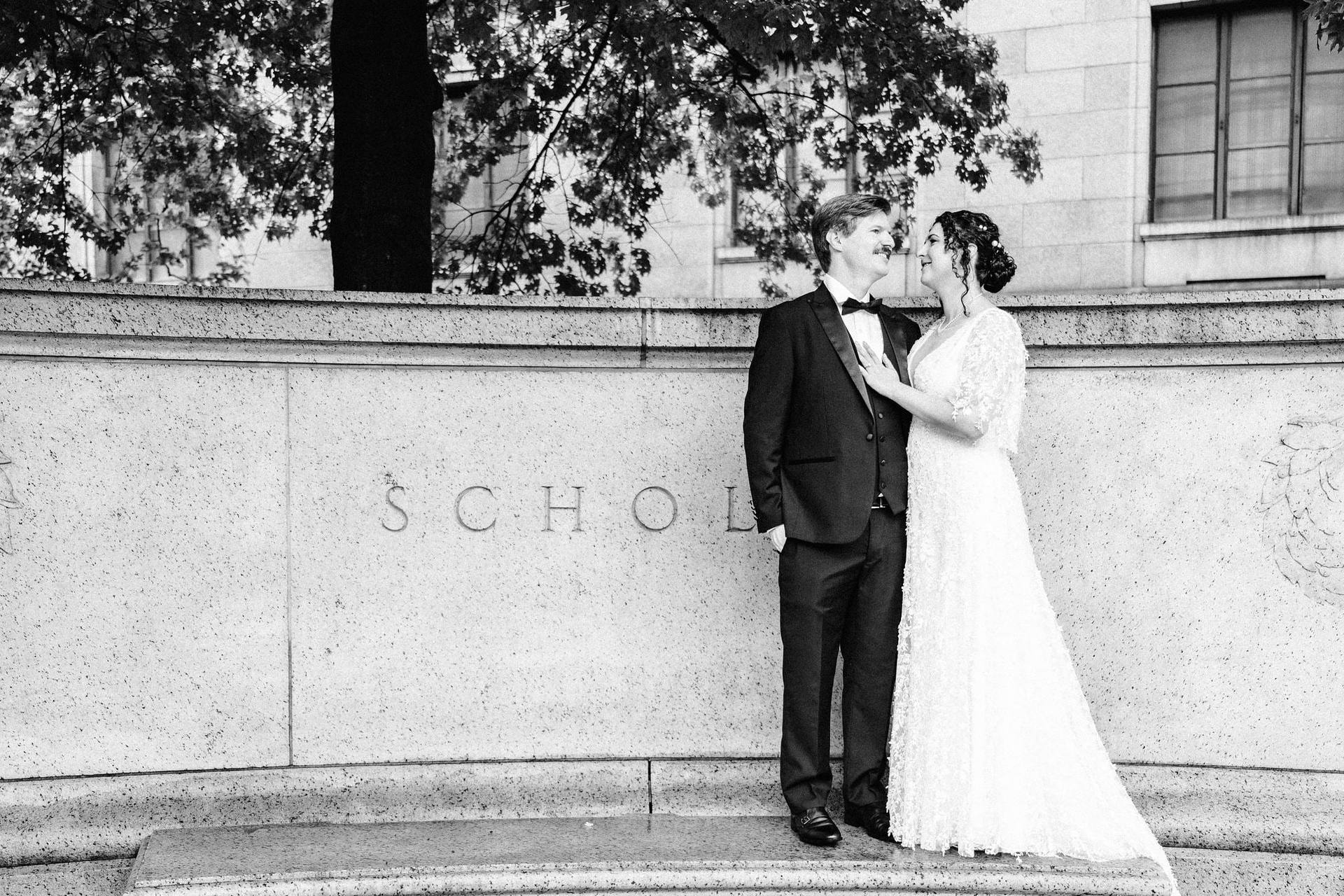 Quiet moment against carved stone, black and white