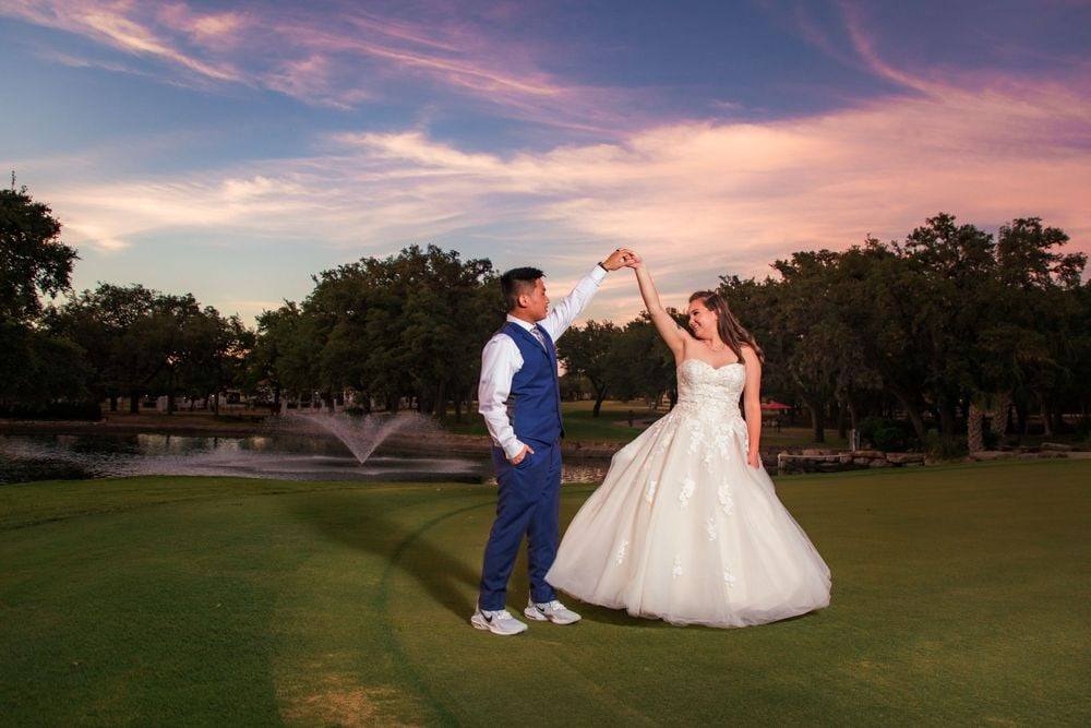 Twirling under a pastel sunset sky