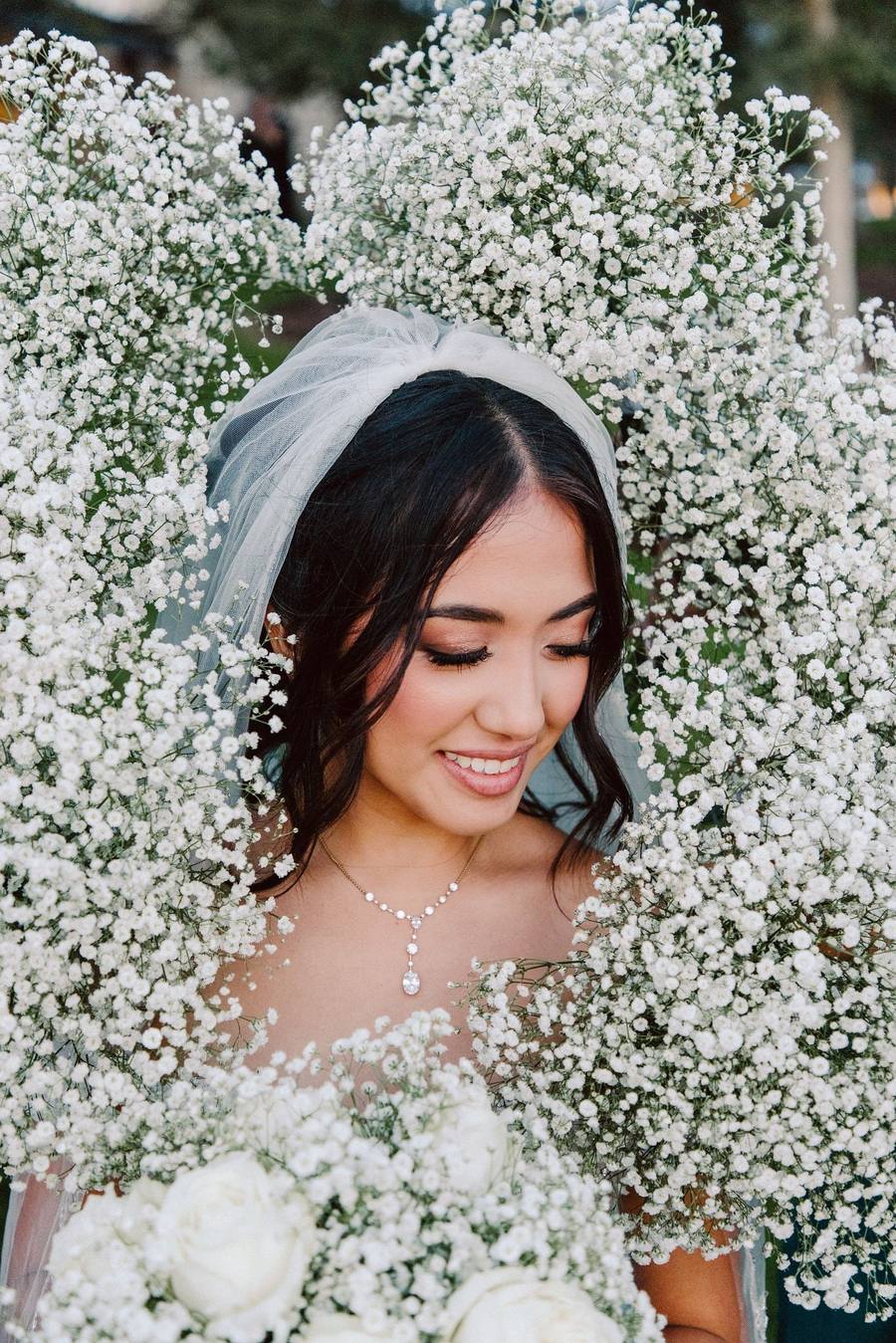 Bride framed by baby's breath flowers
