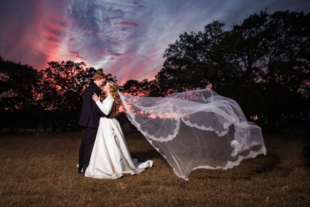 Sunset portrait with sweeping cathedral veil
