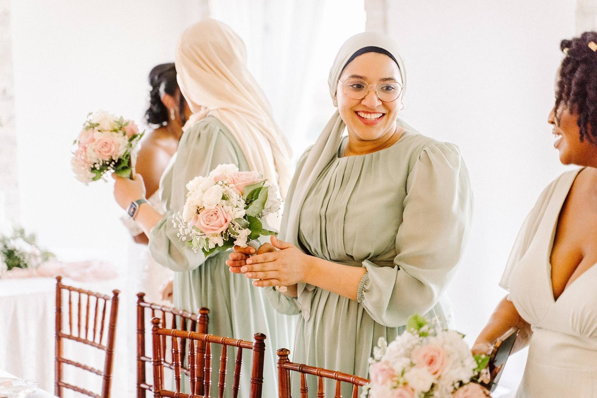 Bridesmaids sharing a laugh before the ceremony
