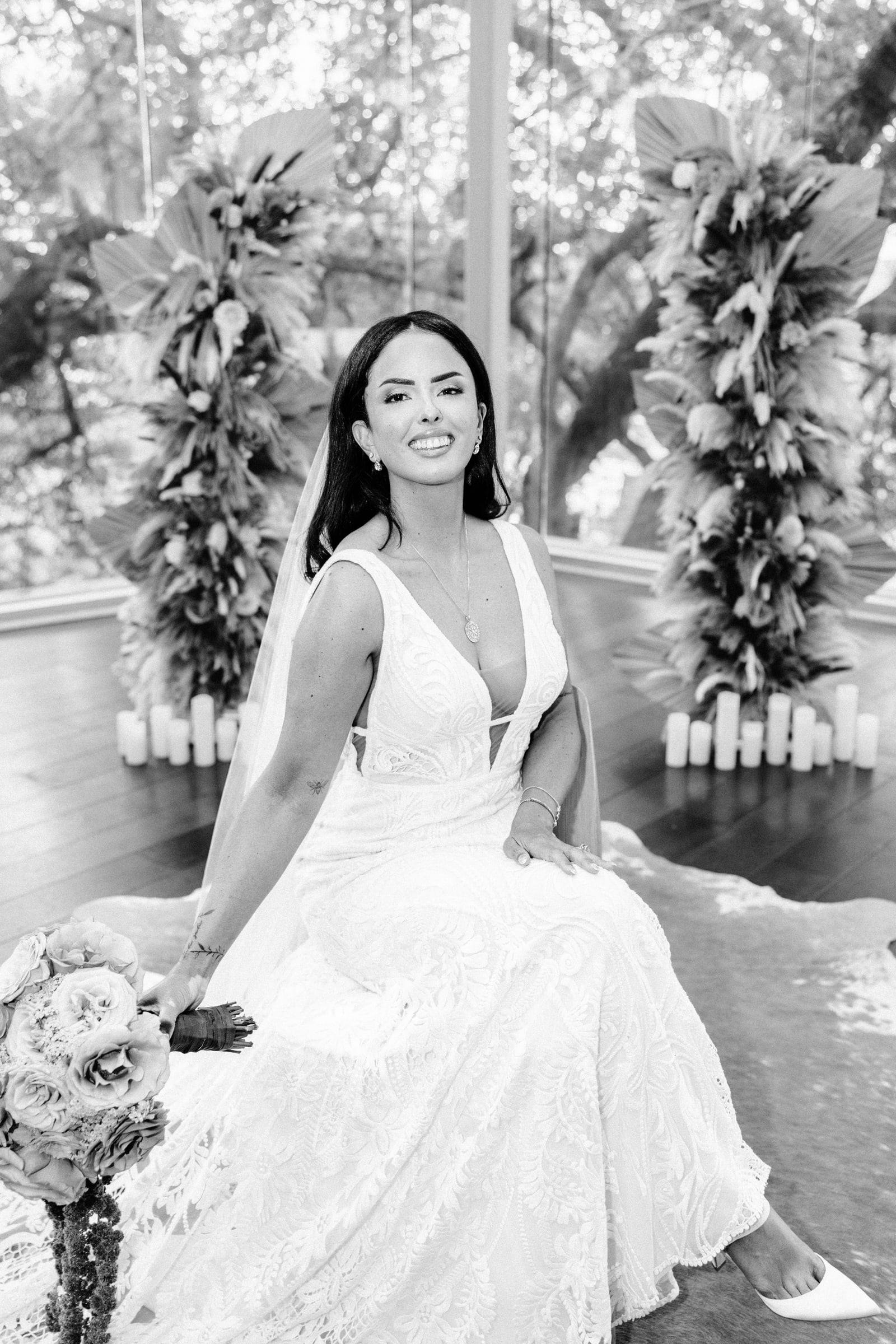 Black and white bridal portrait in a glass pavilion
