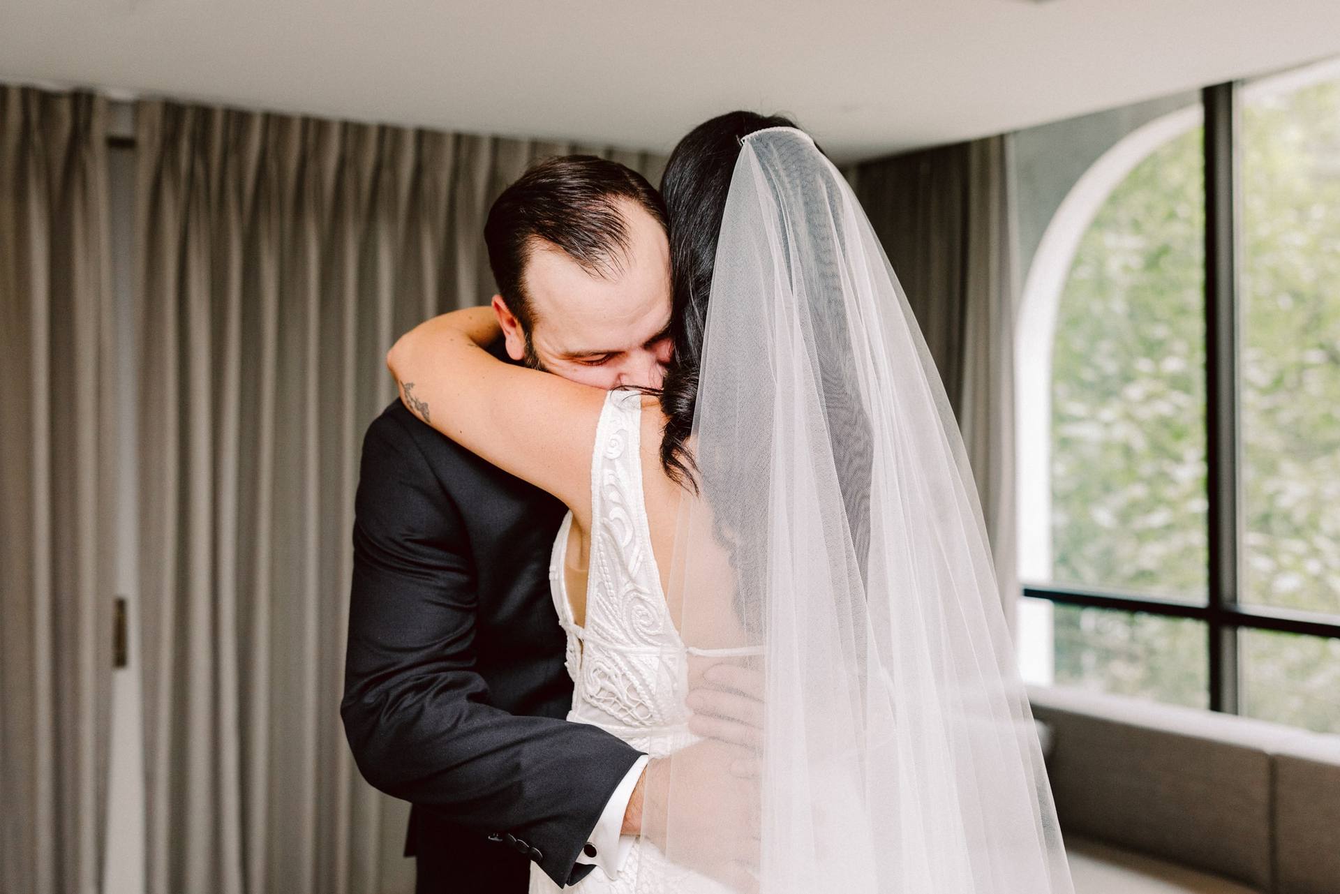 Emotional embrace during the first look