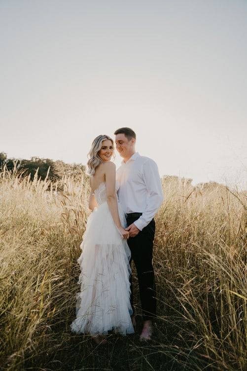 Couple in the tall summer grass