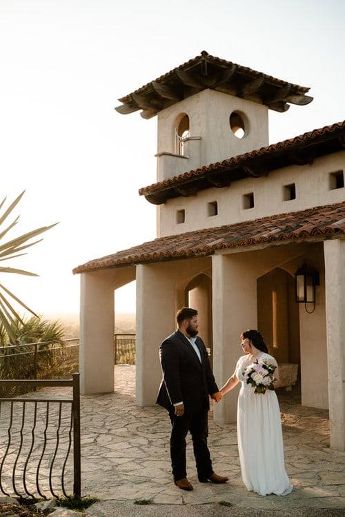Couple beneath the mission tower