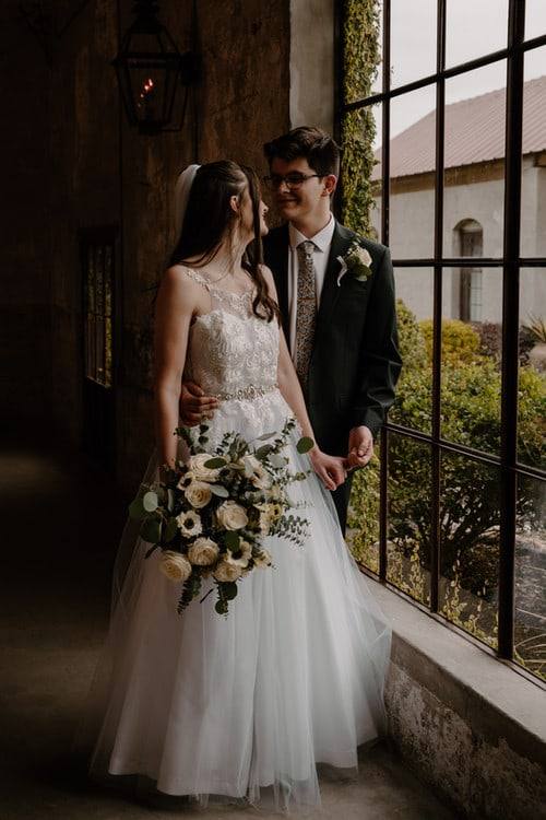 Couple by the greenhouse window
