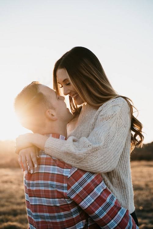 Sun-flare embrace in a plaid blanket