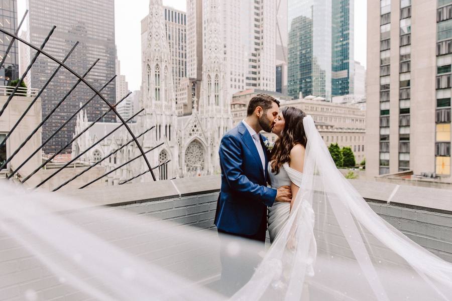 Rooftop kiss with St. Patrick's Cathedral and skyline behind