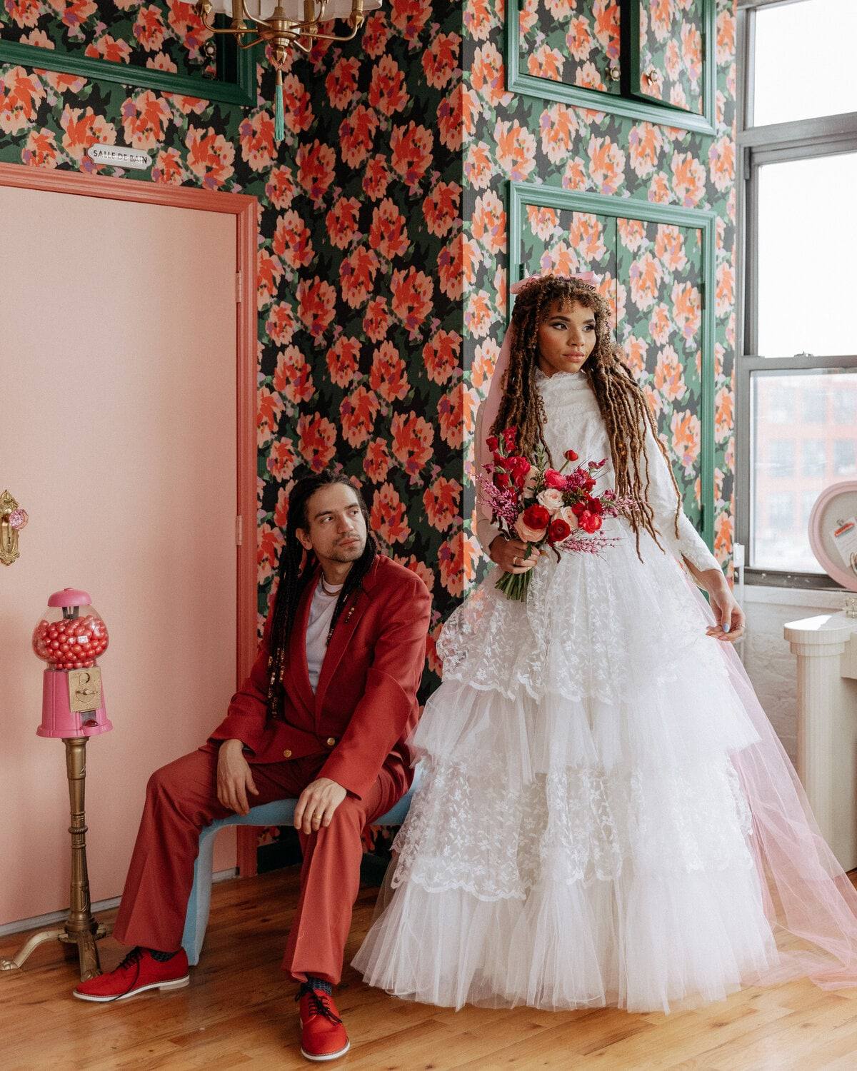 Editorial bride against bold floral wallpaper