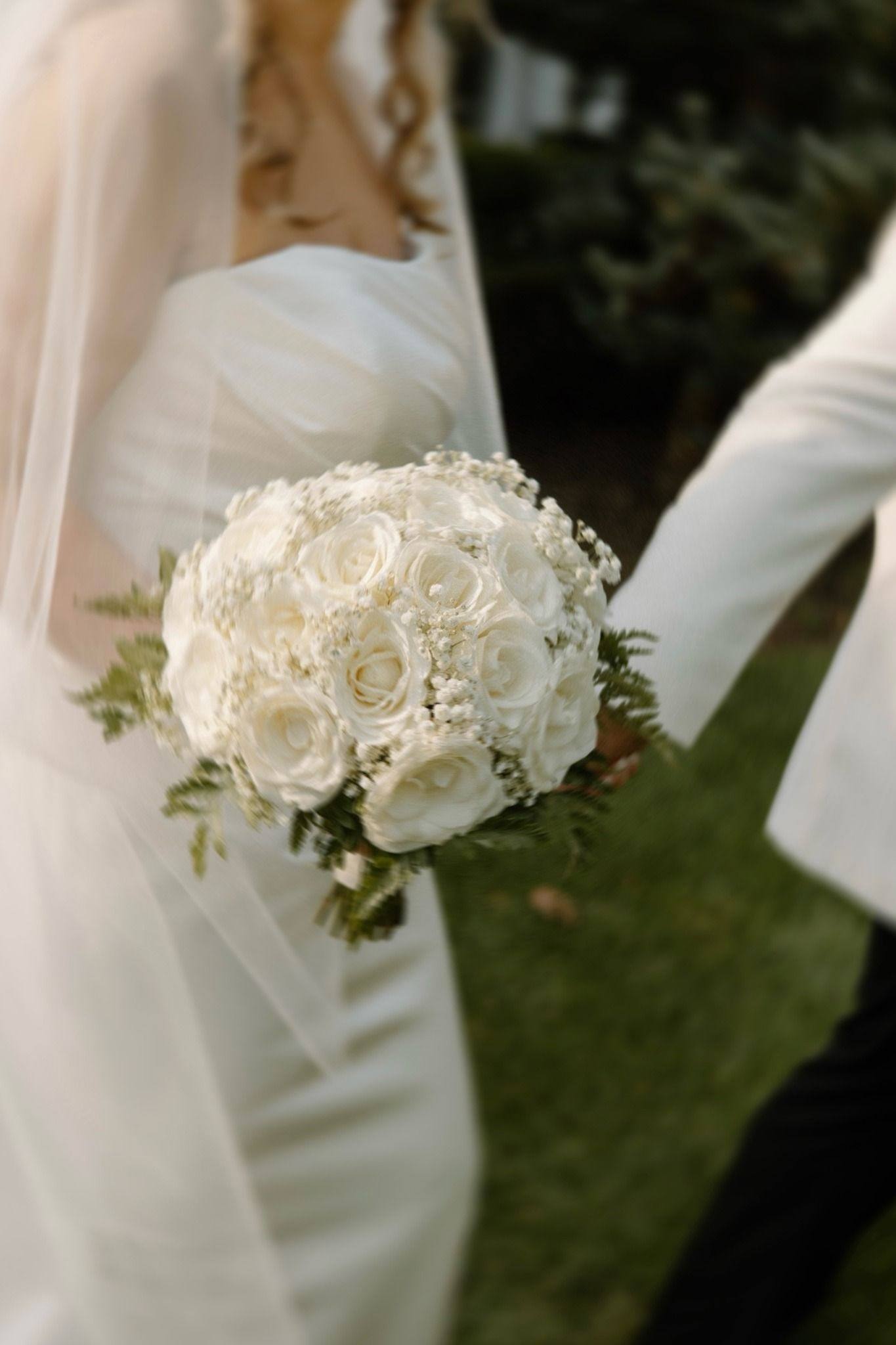 Bouquet in hand, boutonniere close
