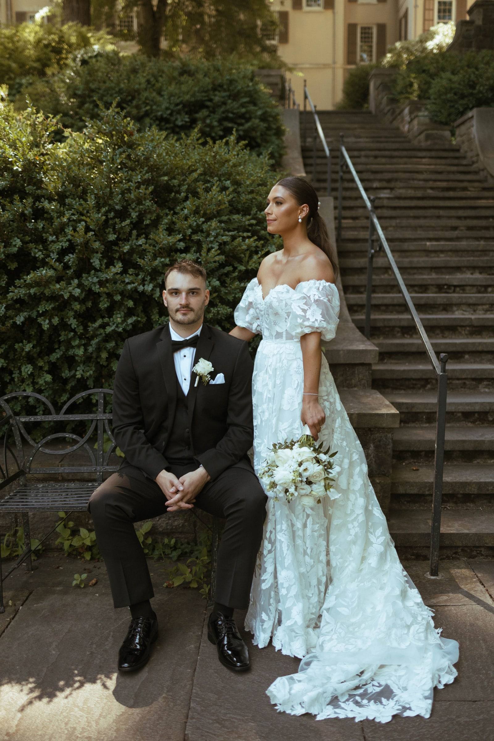 Bride descending stairs above the city