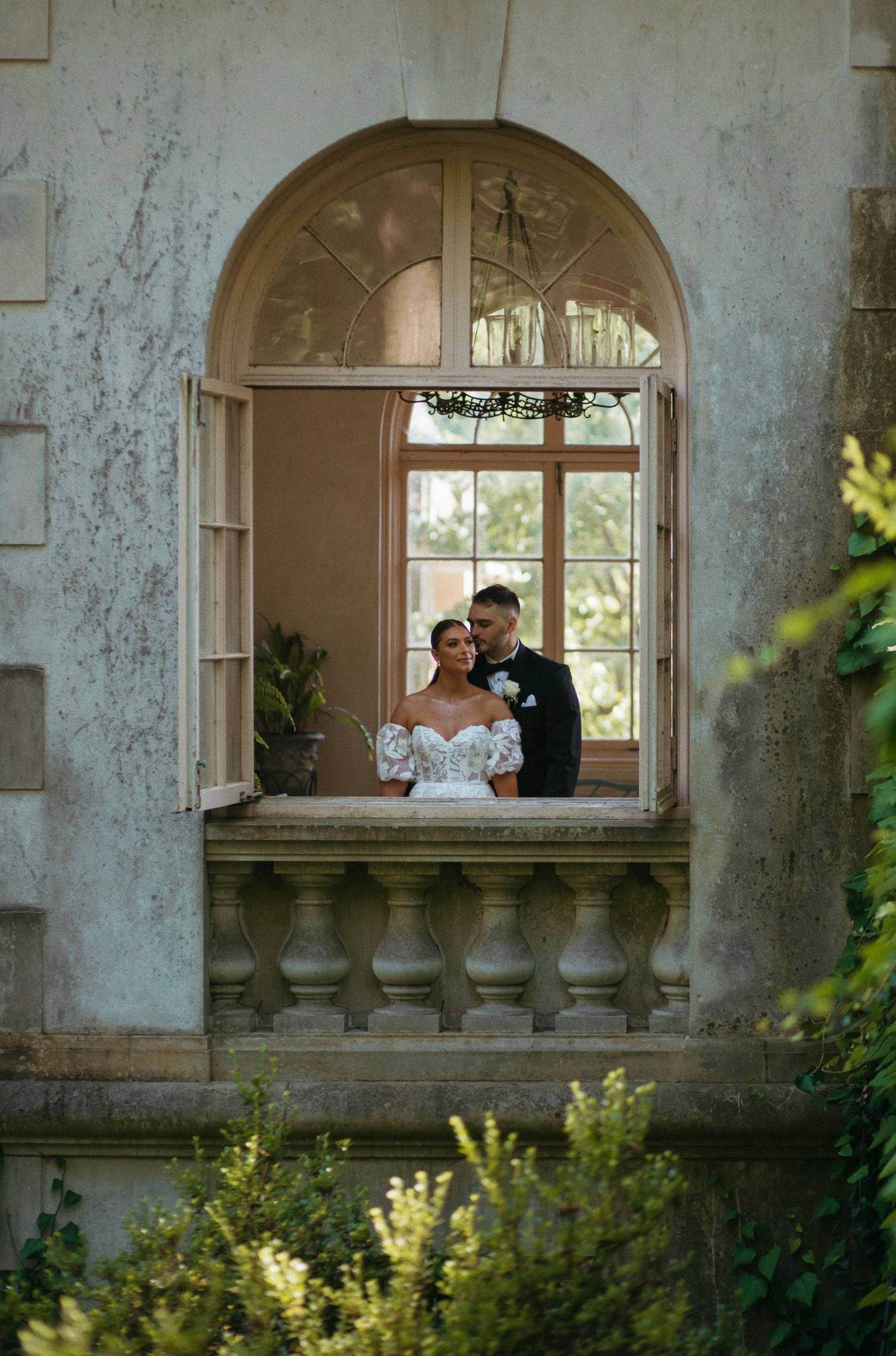 Couple framed in the arched window