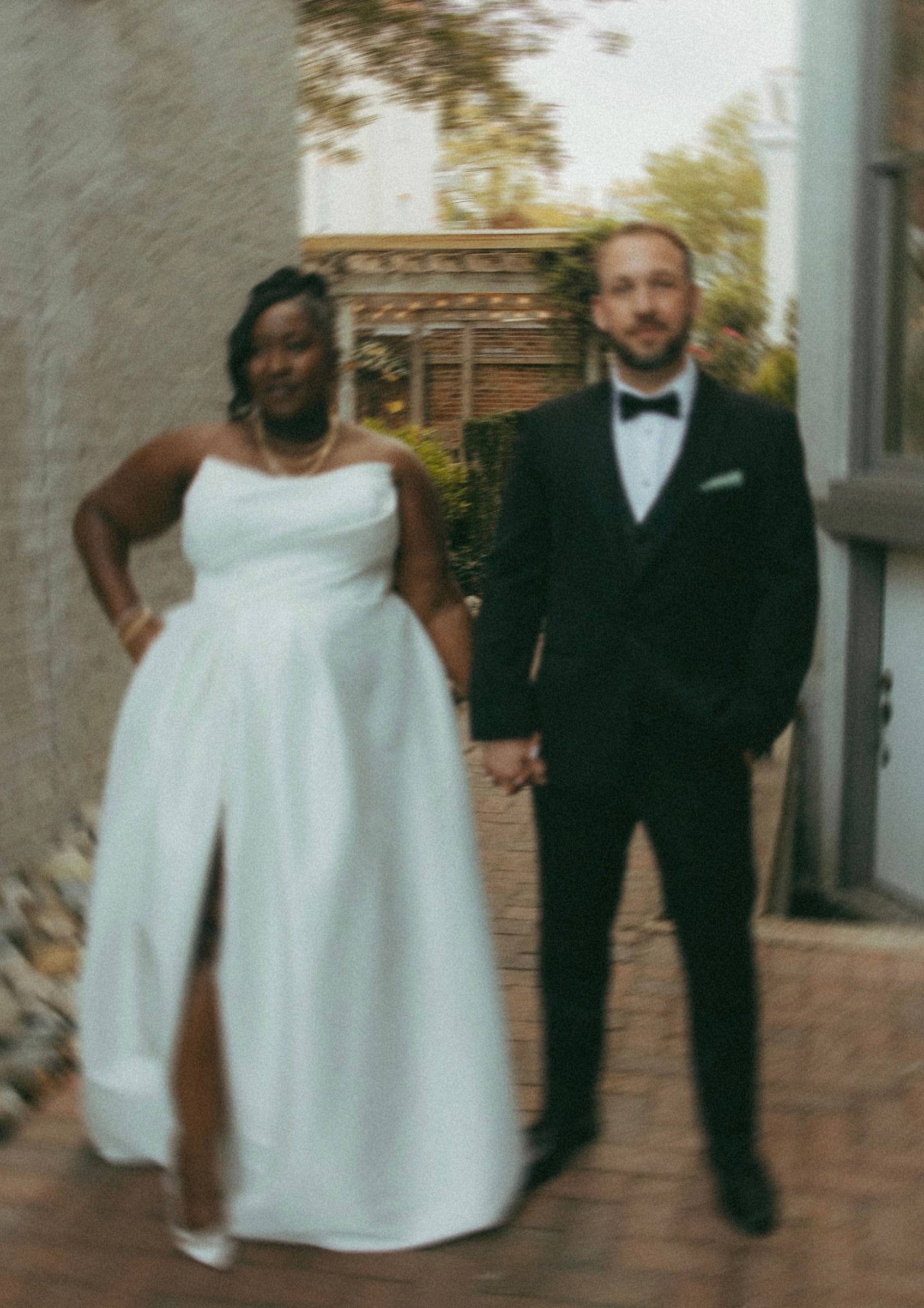Bride and groom hand in hand