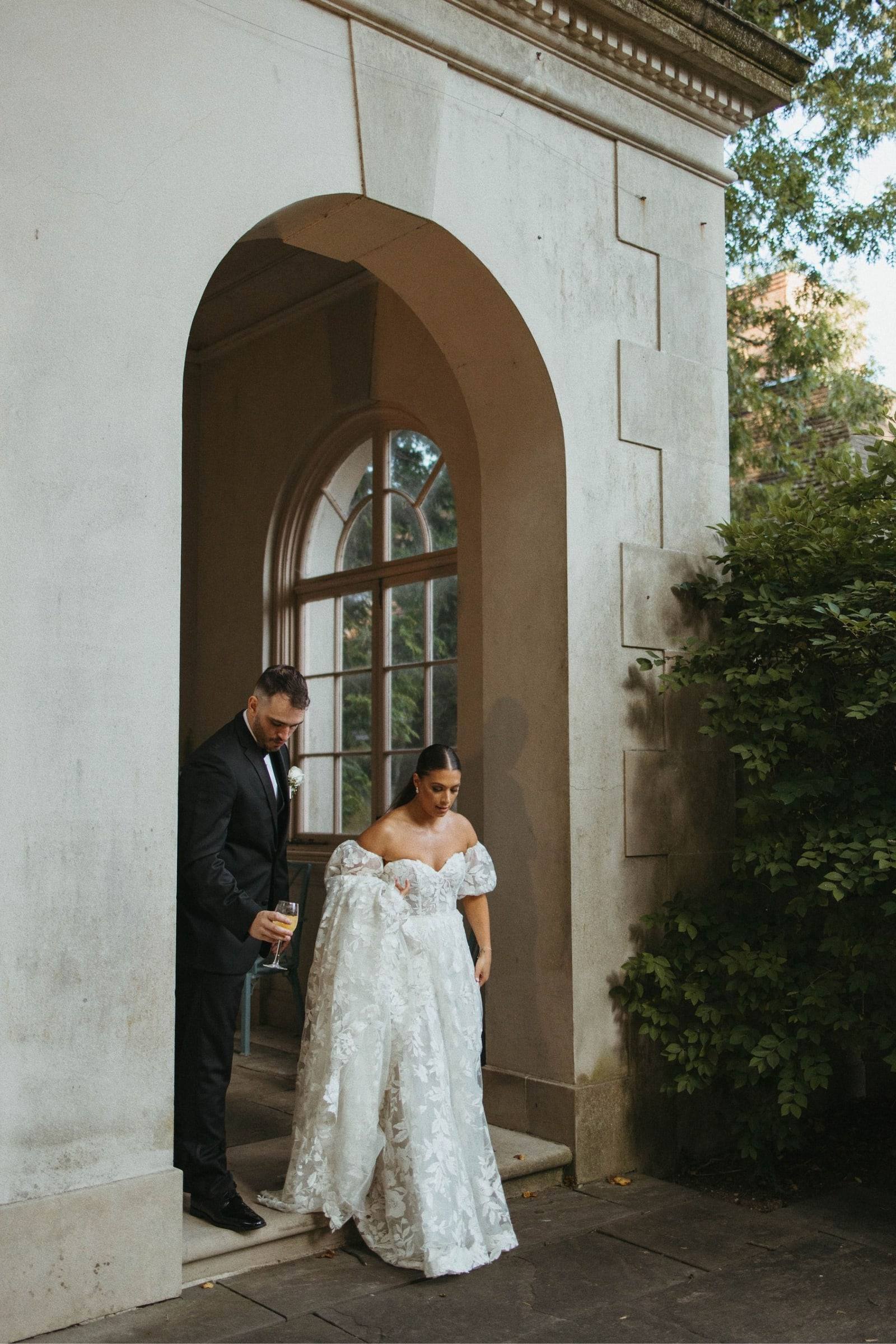 Couple beneath a stone archway