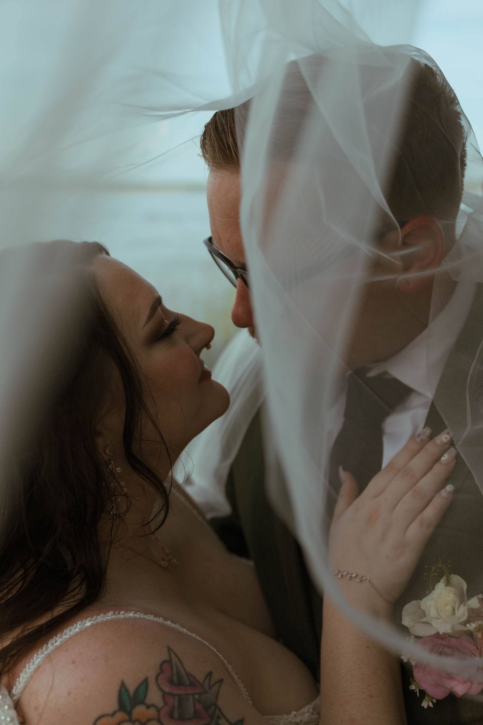 Veiled embrace in soft light