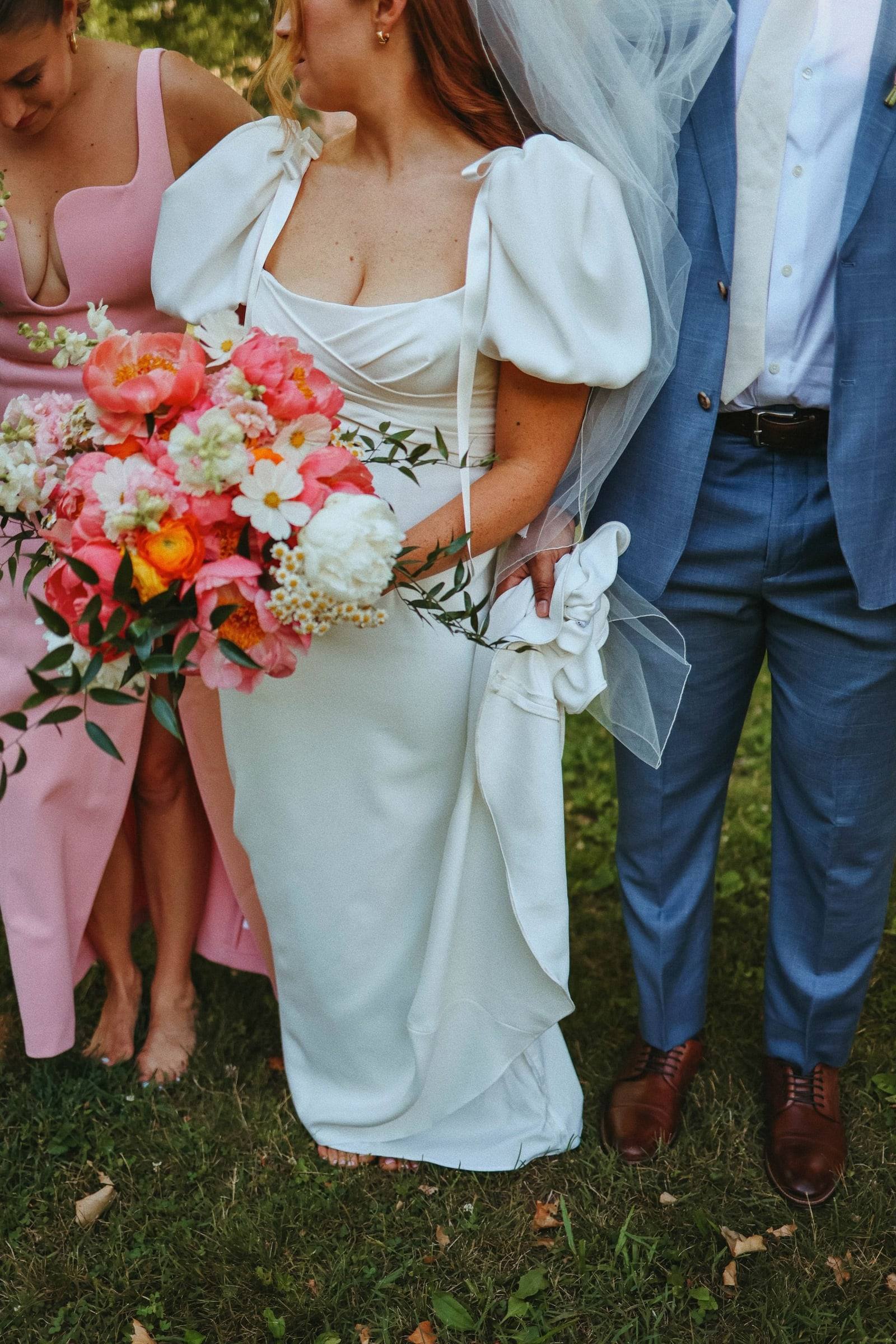 Bride with her bouquet in the garden