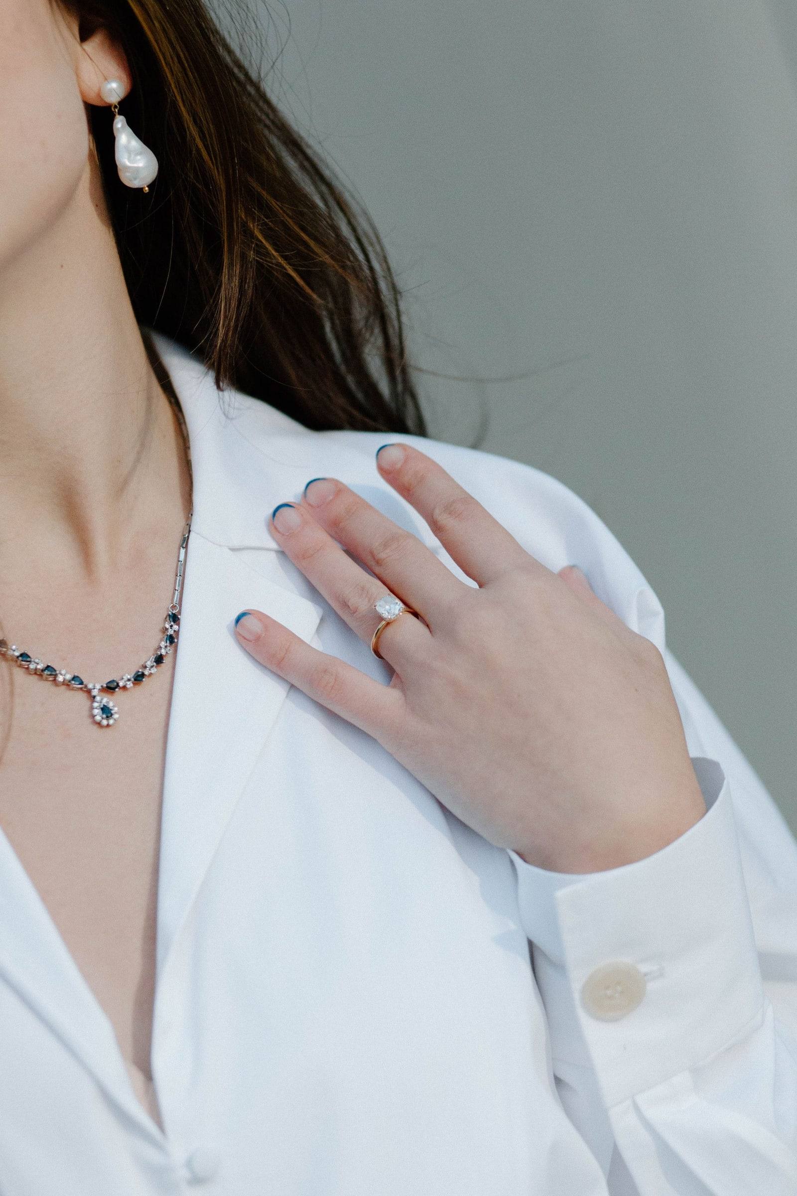 Detail of earring and collarbone