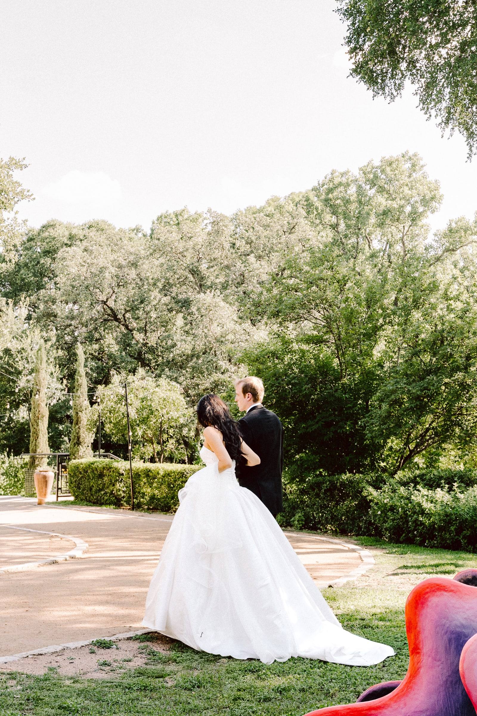 Bride and groom in the garden clearing