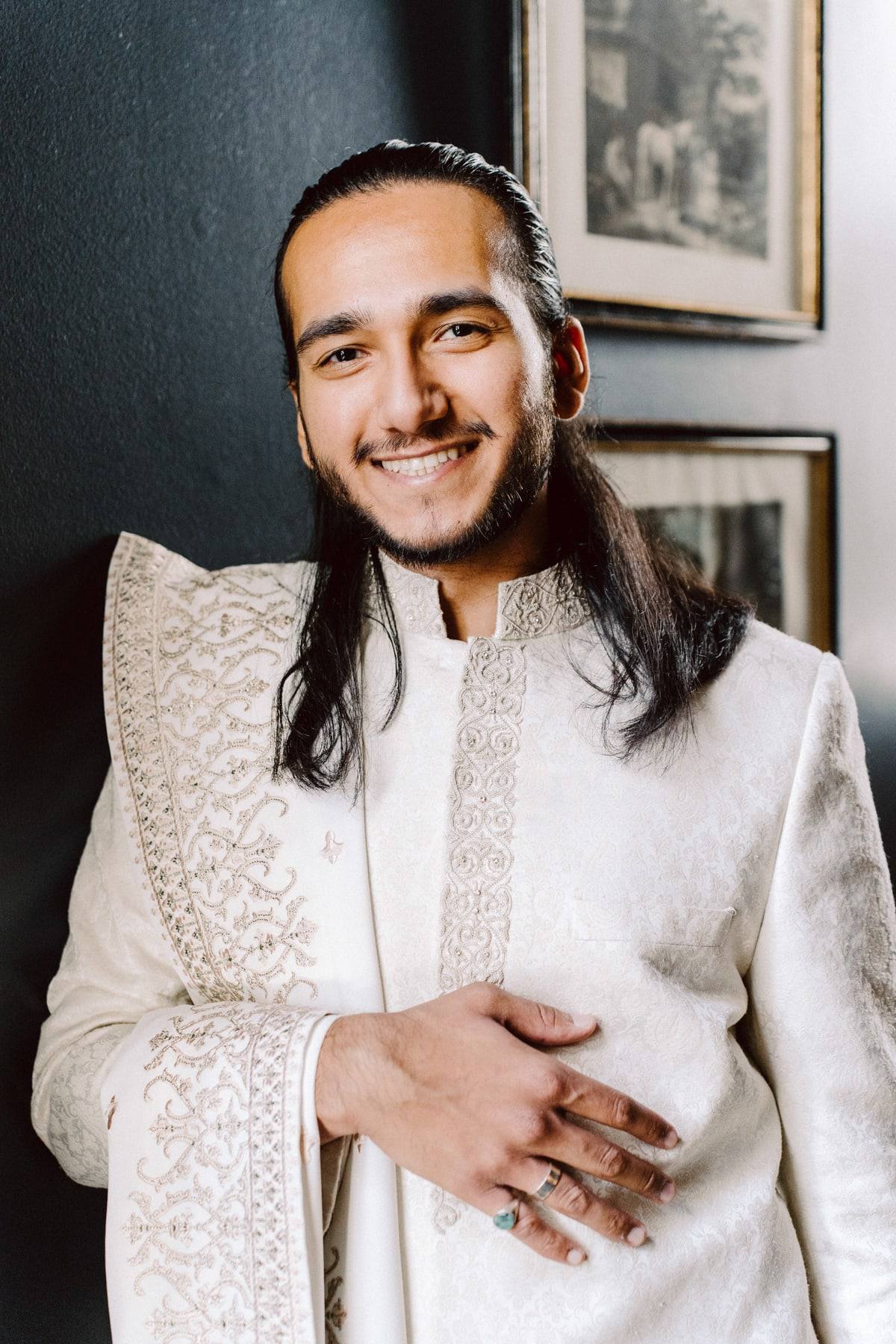Sherwani portrait with an easy laugh
