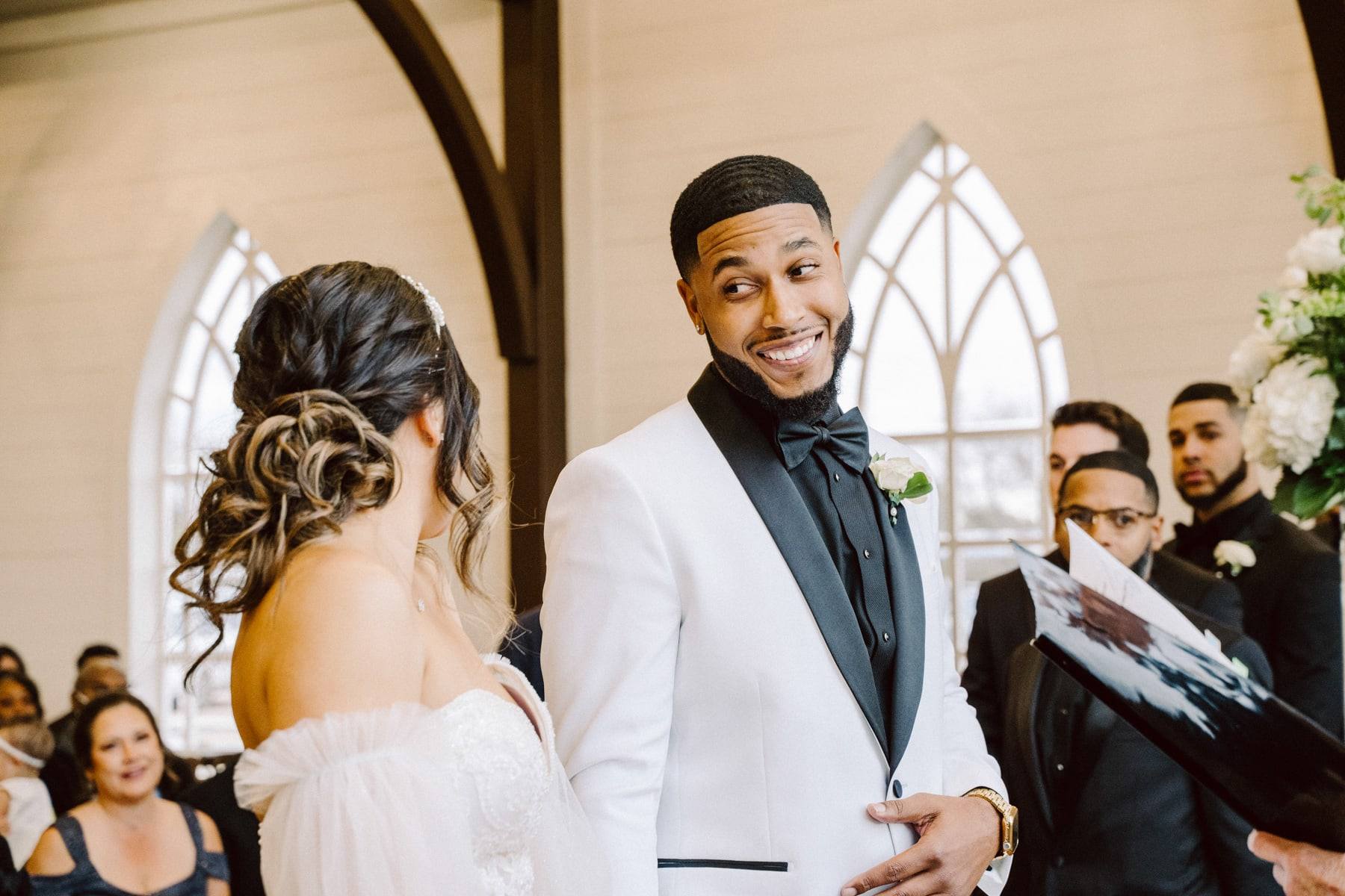 Chapel moment, groom in white jacket
