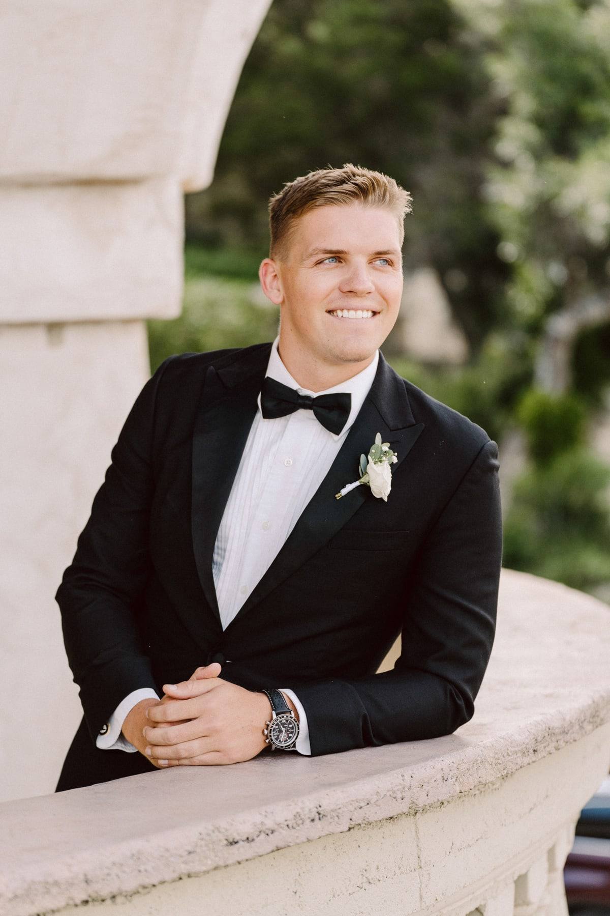Groom portrait at the balustrade