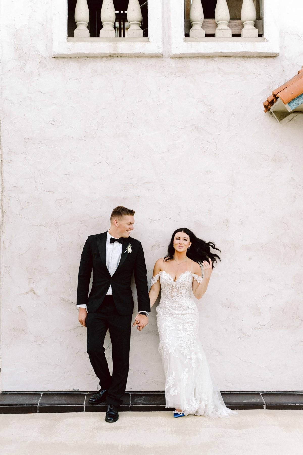 Couple at the white estate wall