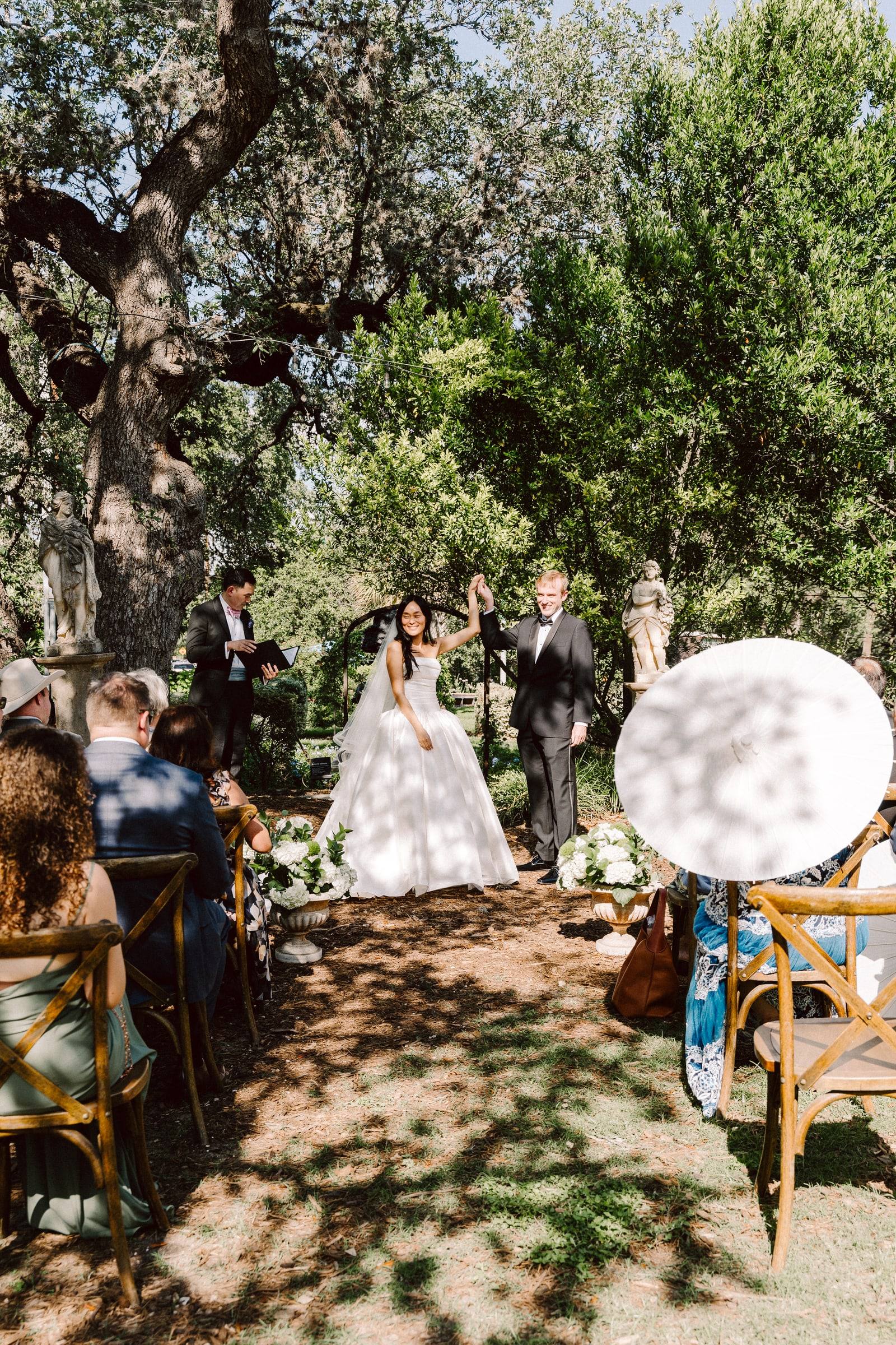Paper-parasol procession through the garden