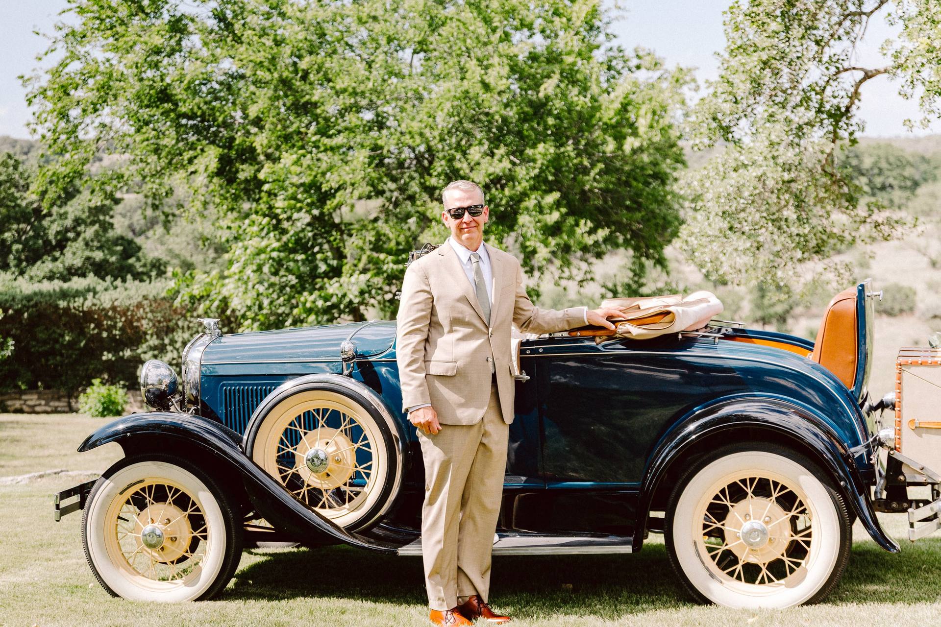 Groom with a vintage roadster