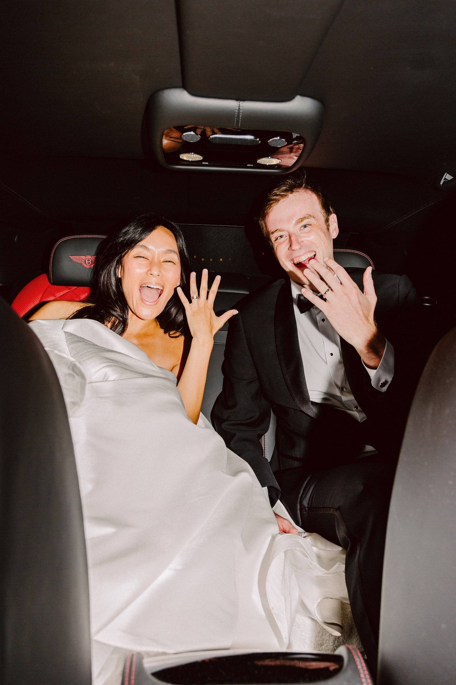 Direct-flash newlyweds showing off rings
